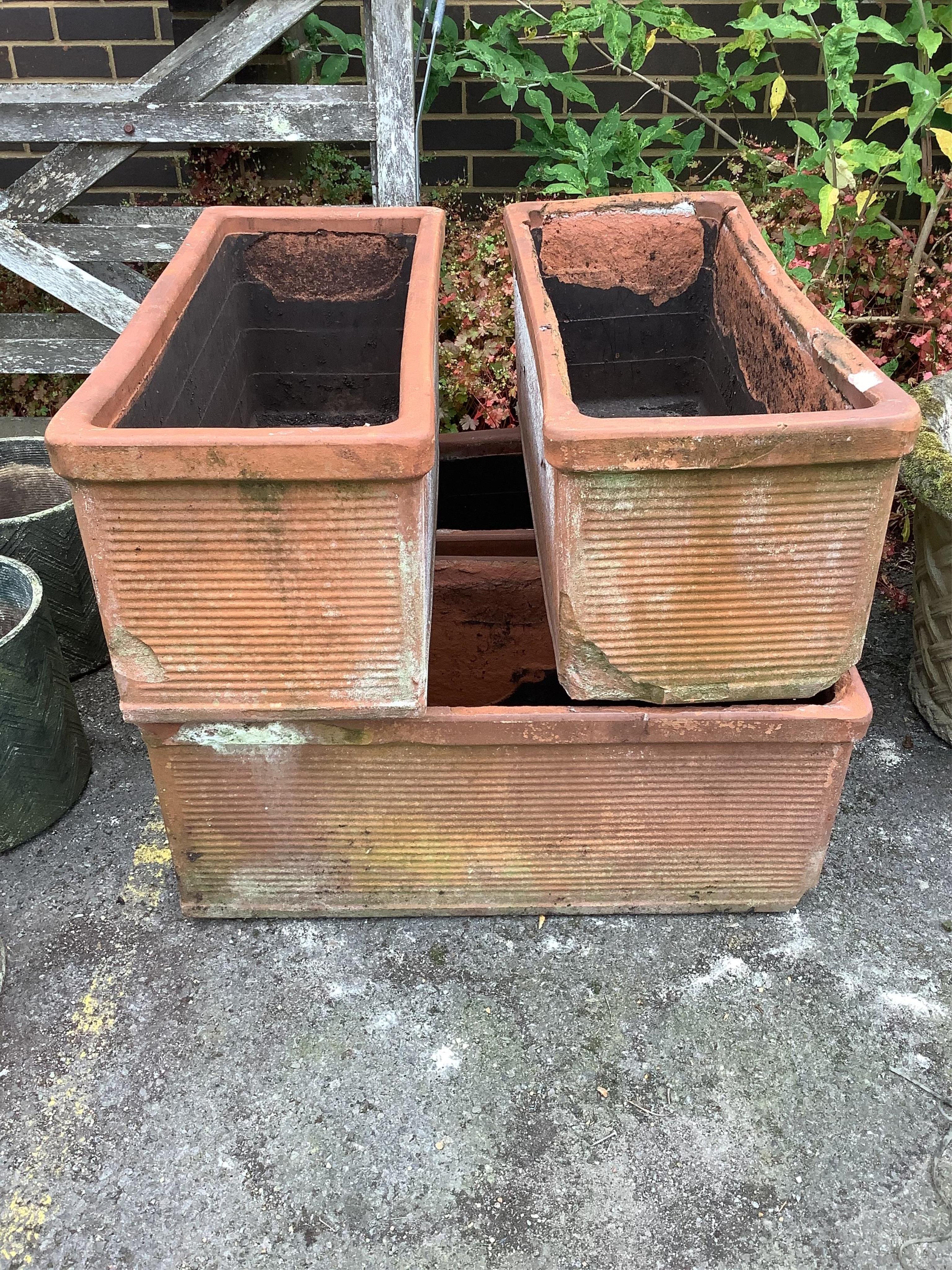 Four rectangular terracotta garden trough planters, width 85cm, depth 36cm, height 36cm. Condition - fair